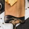 Lynn & Liana Medium Acacia Cheese Board In Black Ember